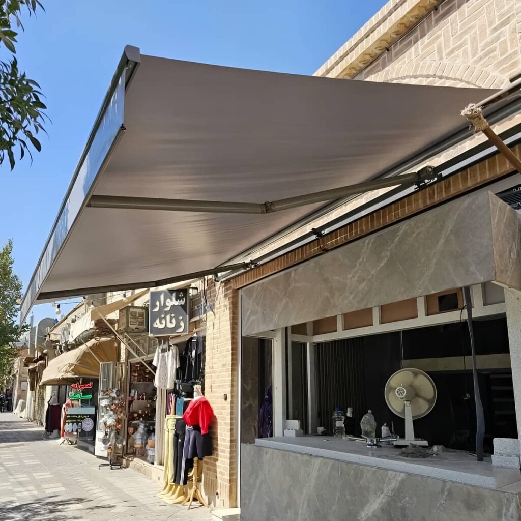 سایبان برقی ایلام مدل بازویی نمای ساختمان